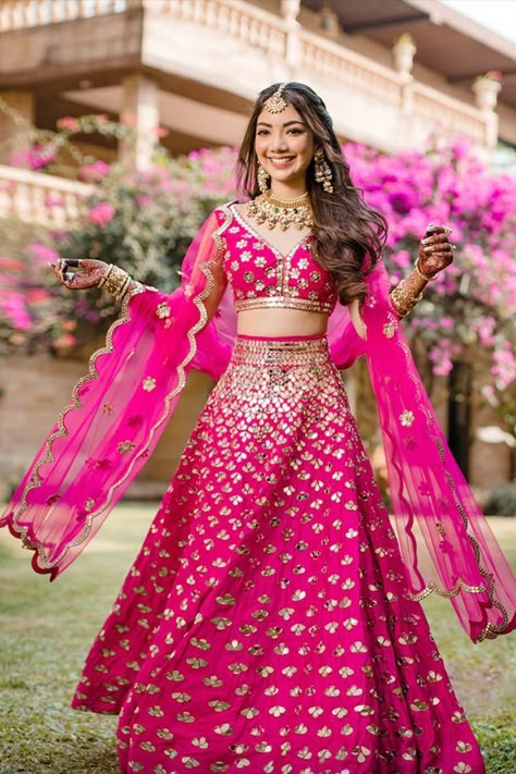 Bride twirling in a Rani pink lehenga! If we could have crushes on lehengas, (which we do time and again), our latest one would be on mirror work lehengas. Sitting and browsing through pretty mirror work lehengas has become our new hobby, and we thought we'd put some of the most lust-worthy ones we've spotted off late for you to love and like, and are perfect for your wedding festivities! Sangeet Dress, Pink Bridal Lehenga, Lehenga Pink, Mehndi Outfit, Mirror Work Lehenga, Sabyasachi Lehenga, Indian Outfits Lehenga, Pink Lehenga, Engagement Dress