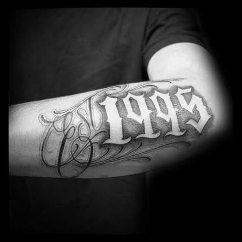 Cool 1995 Negative Space Guys Est Outer Forearm Tattoo Est Tattoo, Est Tattoos, Est. Tattoo, Traditional Chicano Tattoos, Scripture Tattoos, Chicanas Tattoo, Outer Forearm Tattoo, Art Chicano, Arabic Tattoo Quotes For Women