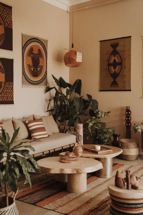 Design your living room with Afro-Bohemian decor that blends traditional African elements and modern minimalist furniture. Use natural materials and bold patterns for a stylish yet culturally rich aesthetic.#AfroBohemianDecor #ModernAfricanStyle #NaturalMaterialInteriors #MinimalistLivingRoomIdeas #AfricanInspiredDesign #BohemianLivingRoomStyle #ModernEthnicDecor African Style Living Room Inspiration, Modern Afrocentric Decor Living Rooms, African Art Decor Interior Design, Afrocentric Room Decor, Afro Home Decor, African Apartment Decor, Afrocentric Apartment Decor, Afro Interior Design, African Style Living Room