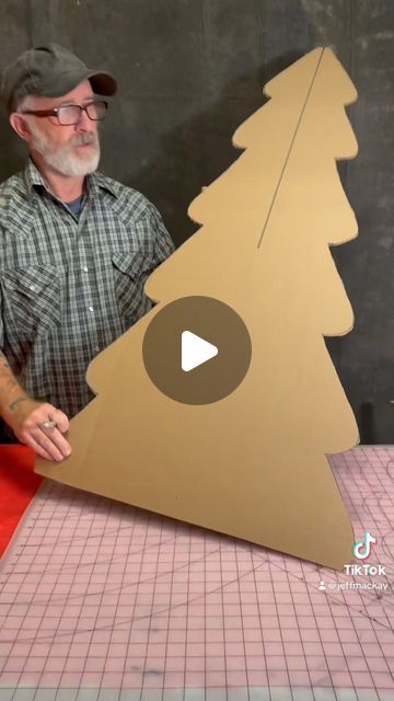 Christmas Tree Diy Cardboard, Diy Card Board Christmas Decorations, Christmas Play Decorations Stage Design, Office Cube Decorating Ideas Christmas, Cardboard Xmas Tree Diy, Cardboard Tree Prop, Card Board Christmas Ideas, Diy Grotto Christmas, Christmas Tree Cardboard Diy