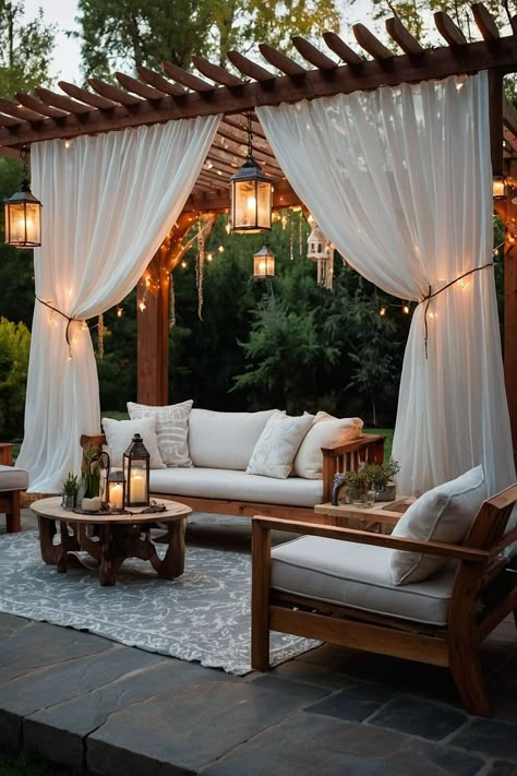 Design a dreamy patio with a pergola draped in sheer curtains and adorned with fairy lights. A perfect cozy retreat. Add timeless elegance to your space with classic balcony curtains Dubai, perfect for balconies that deserve grace. These classic designs beautifully combine functionality, offering shade while enhancing your outdoor decor with a hint of tradition.#BalconyCurtainsDubai #ClassicDesign #TerraceElegance #PatioStyle #OutdoorLuxury #BalconyMakeover #TimelessDecor #DubaiLiving Curtain Pergola, Black And White Patio Decor, Pergola With Curtains, Dreamy Patio, Zen Retreat, Black And White Patio, Steel Decor, Balcony Curtains, Striped Rugs