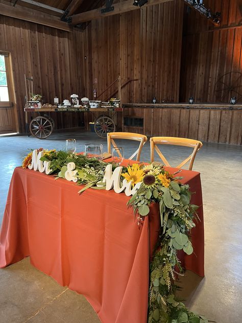 Burnt Orange Linen, Gold Rim Glassware Burnt Orange And Ivory Wedding Table, Burnt Orange And Sage Green Wedding Decor, Rust Orange Wedding Table Decor, Burnt Orange Table Setting Wedding Ideas, Burnt Orange Sweetheart Table, Rust Reception Table, Burnt Orange Table Runner With Greenery, Teal Wedding Centerpieces, Burnt Orange Decor