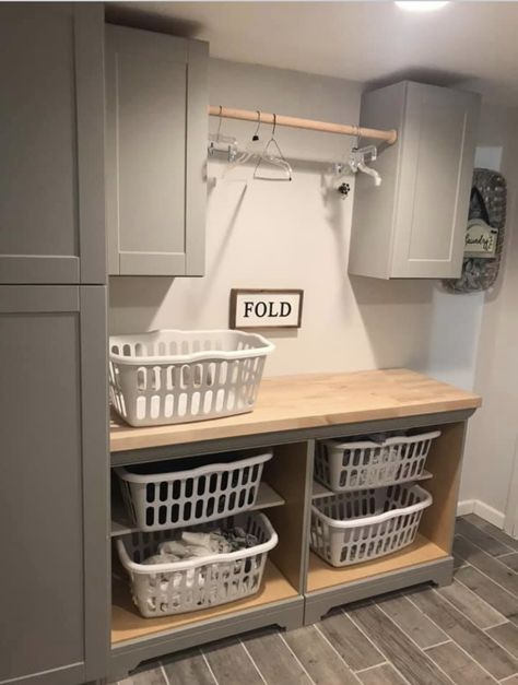 We used two matching bathroom vanities(minus the wash basin top) from Home Depot and just removed the doors for the laundry basket storage and added a butcher block counter top. Laundy Room, Laundry Room Update, Laundry Room/mud Room, Wash Room, Laundry Room Wallpaper, Dream Laundry Room, Basement Laundry, Mudroom Laundry Room, Laundry Room Layouts