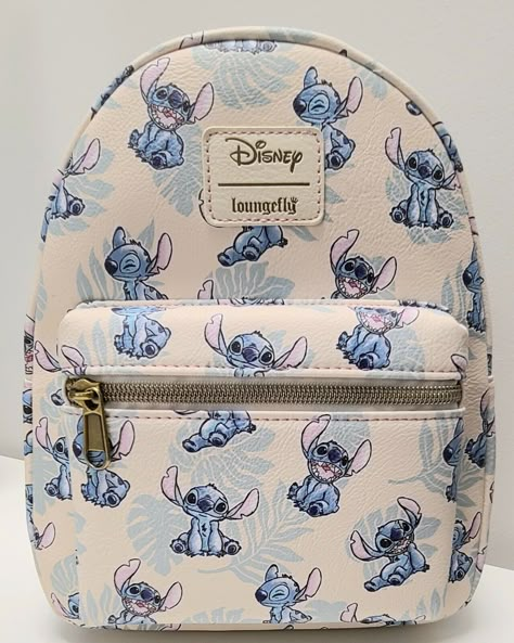 The photos for this listing are stock photos. This means that the print design on the bag shown in the pictures is not necessarily the exact bag that you will receive. It will have all the same characters. They just might be featured in different locations on the bag. This Loungefly Disney Lilo & Stitch Tropical Leaves Mini Backpack is perfect for any Disney fan! With a cute Stitch character design and tropical leaves accents, this backpack is a must-have accessory. The white handle/strap and brass hardware color create a stylish contrast with the multicolor exterior material of polyurethane. It's the perfect size for carrying your essentials, and the backpack style makes it easy and comfortable to wear for any occasion. Add this to your collection today! Approximate Size: 8 x 5 x 11 Inche Stitch Character Design, Lilo And Stitch Merchandise, Lilo And Stitch Quotes, Stitch Backpack, Stitch Toy, Lilo And Stitch Drawings, ليلو وستيتش, Stitch Quote, Stitch Character