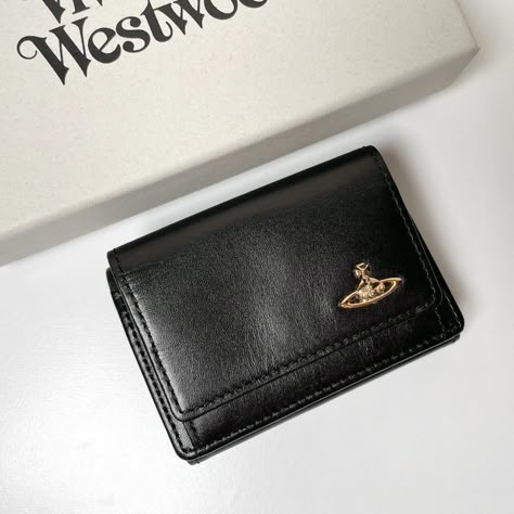 Vivienne Westwood Trifold Wallet 3318M1J Black NEW WATER ORB Description Guaranteed 100 % Authentic Product ! Condition: New Brand Vivienne Westwood color black style vintage Features tri-fold                                                                                       Visit our store: pinzou-japan Store ※ The color might be slightly different from the actual product due to the effect of light and monitor setting ※ Delivery to overseas may be delayed due to disasters, bad weather, etc., Vivien Westwood Wallet, Vivienne Westwood Purse, Wallet Aesthetic, Vivienne Westwood Wallet, Wood Wallet, Elegant Wallet, Cute Wallet, Japan Store, Vintage Wallet