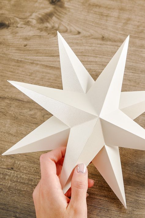 Looking for an easy craft to take your holiday party to the next level? Look no further. Before you get started, pick up your crafting supplies: Astrodesigns cardstock (we used the Astrodesigns Champagne Pearl Cardstock), the free 3D star template, scissors, and glue. Whether you are planning a holiday party with your office, classroom, friends, or family, create one or multiple for ceiling or wall decor. Snag the free downloadable template via the link in bio to get started. *Difficulty: Easy* 3d Star Template, Ideas For New Year, Fun Kids Crafts, Star Template, 3d Star, Downloadable Templates, Nye Party, Paper Stars, Kwanzaa