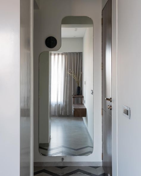 | Emerald retreat | Guest bedroom | Effortlessly blending functionality with style, this guest bedroom’s floor pattern draws you into a space where open and closed storage is accented by elegant glass shutters. The custom-shaped full-height mirror cleverly positioned behind the door amplifies the room, while the bespoke stone light adds a dash of whimsy. #codesigns #SmartDesign #GuestRoomChic #MirrorIllusion #bedroomdesign Photograohy by : @archi.capture_ [ Bedroom Design, Flute glass... Full Height Mirror Design, Mirror Illusion, Glass Wardrobe, Full Mirror, Floor Pattern, Chic Spaces, Mirror Design, Mirror Shapes, Storage Mirror