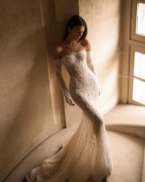 Embodiment of timeless elegance and romance. The Fall/Winter 2025 collection proposes a new vision for the modern bride with the #Charlotte gown, a mermaid silhouette featuring a straight neckline and graceful off-the-shoulder sleeves. Made from exquisite lace and adorned with intricate beaded details, this gown captures the essence of luxury. Complemented by a matching veil, the Charlotte gown embodies the enchanting beauty and profound emotions of the bridal journey. #LPGfall25 #BridalCou... Hailey Bieber Wedding Dress Reception, Ethereal Wedding Dress Mermaid, Lace Wedding Dress With Removable Sleeves, Wedding Dresses Lace Aesthetic, Mesh Lace Wedding Dress, Corset Wedding Dress Fit And Flare, Lace Of The Shoulder Wedding Dress, Wedding Siren Dress, Katerina Bocci Bridal