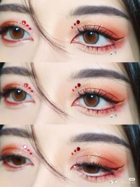 Red Asian Eye Makeup, Red Eyeshadow Rhinestones, Jewel Eye Makeup Rhinestones, Red And Gold Makeup Looks, Simple Red Makeup, Simple Red Makeup Looks, Red Eyeshadow Makeup Looks, Red Douyin Makeup, Christmas Makeup Looks Simple