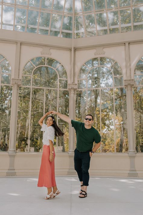 Happy dance at Palacio de Cristal El Retiro Park - Madrid, Spain  #spaintravel #spain #coupletravel #outfits #españa #ootd Madrid Couple Photography, Spain Moodboard, Madrid Summer, Madrid Pictures, Couple Travel Photos, Retiro Park, Spain Trip, Madrid Travel, Couple Travel