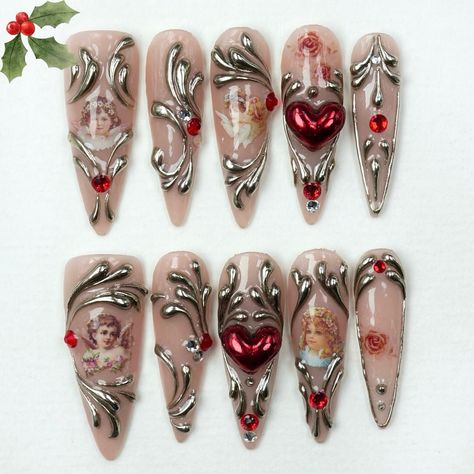 💕✨ Fall in love with the magic of the season! Our Angel’s Embrace design combines delicate cherub art, elegant silver accents, and festive red gems for the ultimate holiday glam. 🎄💅 Perfect for making your Christmas extra special—one stunning fingertip at a time! ❤️✨ 🎁 Shop now and let your nails shine this season! ✨ #donailsart #pressonnails #nailsart #holidaynails #christmasnails #angelnails Christmas Nails Gems, Nails Gems, Cherub Art, Red Gems, Vday Nails, Angel Nails, Long Acrylic, Holiday Glam, Angel S