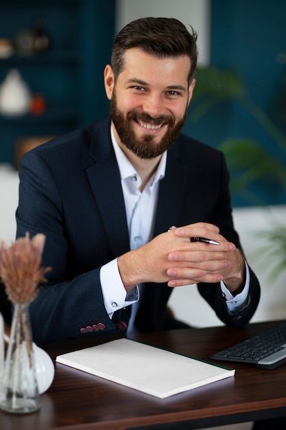 Free photo front view smiley man posing ... | Free Photo #Freepik #freephoto #worker-man #worker #job #career Office Worker Photography, Desk Photoshoot, Cv Picture, Profile Photoshoot, Business Man Photography, Male Office, Linkedin Photo, Office Photography, Job Pictures