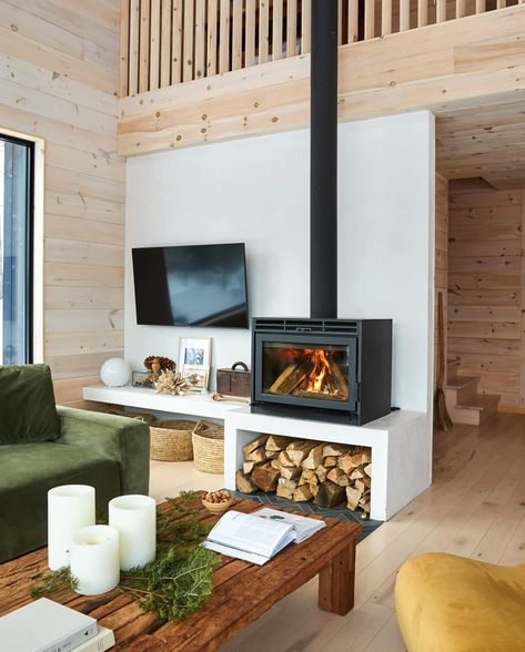 A Relaxed Cottage Interior Inspired By The Idyllic Serenity Of Its Surrounds | Style at Home Tv Next To Wood Stove, Scandi Wood Stove, Off Center Fireplace, Scandinavian Fireplace, Sea Biscuit, Stove Ideas, Tv Fal, Wood Stove Fireplace, Wood Heater