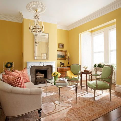 Bathed in light from the bay window, buttery yellow walls keep the large space from becoming too formal while putting the focus on the confection of period details. Yellow Living Room Colors, Yellow Walls Living Room, Yellow Rooms, Yellow Decor Living Room, Furnitur Ruang Keluarga, Walls Living Room, Yellow Room, Yellow Living Room, Living Room Color Schemes