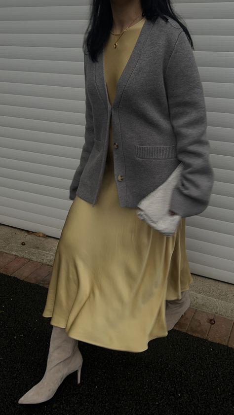 Yellow satin dress + grey Khaite style cardigan + knee high boots Khaite Cardigan Outfit, Khaite Style, Yellow Grey Outfit, Yellow And Grey Outfit, Satin Slip Dress Outfit, China Outfit, Aw Style, Yellow Satin Dress, Slip Dress Satin