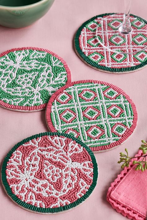 Add a touch of character while also protecting your table with this set of 4 Nina Campbell coasters. The set boasts intricately hand-beaded decorative designs in a mix of corals and greens. The geometric and trellis patterns along with the contrasting colours will provide a bold addition to your home. Set of 4. 2 different designs. Hand-beaded. Wipe clean only. 4 x Coasters Main 100% Glass. Backing 50% Cardboard, 50% Polyester.#Diy_Beaded_Coasters #Beaded_Coasters_Pattern #Beaded_Coasters_Diy #Beaded_Home_Decor Bead Decorations Home Decor, Beaded Coasters Diy, Beaded Home Decor, Bead Coasters, Beaded Coasters, Crafts With Beads, Beaded Decor, Embroidery With Beads, Beaded Patterns