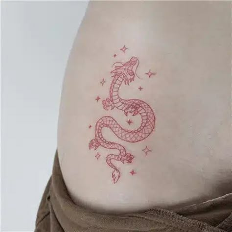 Minimalist Chinese Dragon Tattoo Red Dragon Tattoo Minimalist, Red Dragon Small Tattoo, Simple Red Dragon Tattoo, Red Colored Tattoos, Tiny Dragon Tattoo Chinese, Tattoo Idea Dragon, Simple Small Dragon Tattoo, Single Needle Dragon Tattoo, Red Cute Tattoos