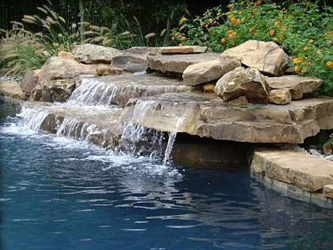 Small Pool Water Features | InTheSwim Pool Blog Pool Waterfall Landscaping, Shallow Shelf, Pool With Waterfall, Pool Waterfalls, Waterfall Landscaping, Pondless Water Features, Swimming Pool Waterfall, Rock Waterfall, Pools Backyard Inground