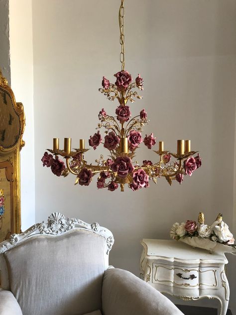 "Italian hand forged wrought iron 8 lights gold leaf chandelier, ceramic roses I want to introduce you to the collection of wrought iron chandeliers made in cooperation with the best artisans in Florence. This is a 8 lights chandelier in wrought iron with a luminous gold leaf finish. They can have pink, blue or ivory ceramic roses and match very nicely with the gold structure. Crystal blossoms had a touch of luminous elegance to the whole chandelier. Color of structure and roses can be customize Leaf Chandelier, Crystal Lights, Iron Chandeliers, Dream Room Inspiration, Decoration Inspiration, Dream House Interior, Cute Room Decor, Room Inspiration Bedroom, Dream House Decor