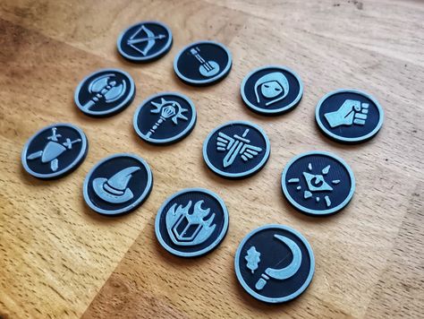 Introducing our 12 piece set of character class tokens for your D&D games! Our set includes all standard 5E character classes to help bring your D&D games to life. These tokens are available as digital downloads in STL format, so you can easily print them on your own 3D printer or send them to a professional printer. The files are also fully compatible with most virtual tabletop programs, allowing you to use them right away. Enhance your gameplay experience with this set of character tokens Character Classes, Virtual Tabletop, Dnd Classes, Gaming Token, Map Background, Magic Cards, Color Printer, Dnd Characters, Banner Ads