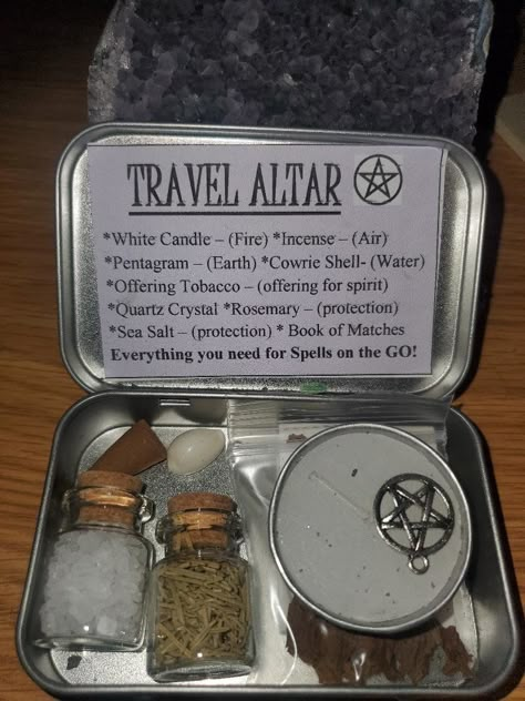 Travel Altar in hinged metal tin! Everything you need, in a cute, little, discreet container! You never know when you'll need it ;)   This TRAVEL ALTAR KIT comes complete with the following ingredients: *White Tea light (fire) *Incense cone (air) *Cowrie Shell (water) *Pentacle charm (earth) *Jar of Sea Salt *Jar of Rosemary. Rosemary is a multi-purpose herb, good for so many things - from healing, to protection, to memory and love, and so much more.  *Quartz Crystal - to generate and amplify *Bag of Offering Tobacco - to leave for spirit, deities, ancestors, etc. *Book of matches Great little kit to have on the go or as a travel altar. Also makes a great gift for the witch in your life! Metal tins are black or silver. Witch box contents are handcrafted with varying materials - meaning ove Altar In A Box Ideas, Altoid Tin Altar, Travel Altar Ideas, Travel Altar Witchcraft, Pocket Altar Witches, Altar Setup Witchcraft, Witch Must Haves, Witch Shop Aesthetic, Box Altar