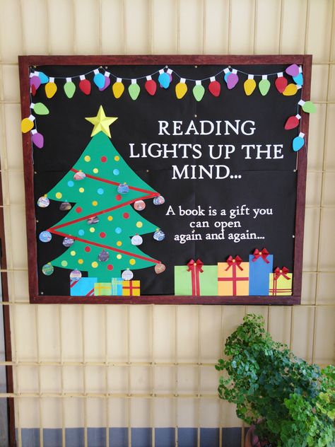 Reading Lights Up The Mind Bulletin Board, Christmas Book Fair Ideas, Library Bulletin Board Ideas Christmas, Christmas Book Themed Door Decorations, High School Bulletin Board Ideas Christmas, Christmas Reading Bulletin Board Ideas, Christmas Bulletin Board Ideas For Library, Christmas Bulletin Boards For Library, December Library Bulletin Board Ideas