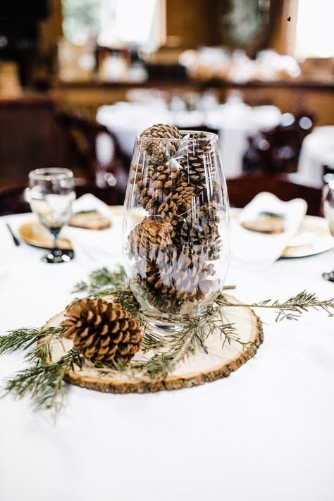 Wedding Pinecones Centerpieces, November Wedding Reception Decor, Center Piece For Winter Wedding, Winter Wedding Rustic Decor, Winter Wedding Olive Green, Rustic Winter Wonderland Party, Wedding Centerpieces With Pinecones, Winter Wedding Pinecones, Winter Wedding Decorations Rustic