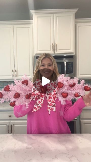 Laura Jeanne on Instagram: "Make this Valentine Swag for only $5.00!!! And everything you see is from Dollar Tree ♥️ You’ll need 2 pink trees, ribbon, and Valentine picks or mini ornaments.  I used floral wire and hot glue to connect the two trees and then used hot glue to adhere the hearts to the tree.  Just add your bow and voila!! #valentines #valentinesday2024 #valentinesdecor #foryoupagereels #foryourpage" Valentine Swag, Heart Wreath Diy, Valentines Window Display, Diy Yard Decor, Diy Valentines Day Wreath, Valentine Wreath Diy, Valentine Door Decorations, Diy Tree Decor, Valentine Centerpieces