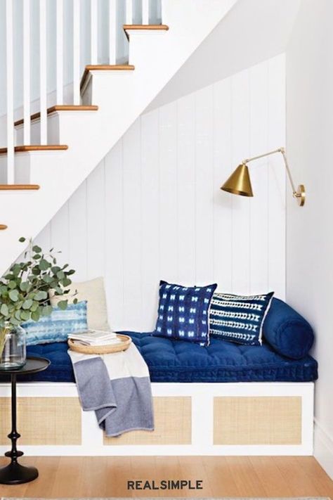 These Zero-Effort IKEA Hacks Look Like a Million Bucks | In the 2020 Real Simple Home, a BESTA TV stand transforms into a cozy reading nook. Thanks to trendy cane doors from Norse Interiors, the built-in storage is hidden out of sight. #pantryorganization #realsimple #organizingtips #organization #kitchenorganization Ikea Reading Nook Hack, Ikea Hack Reading Nook, Ikea Reading Nook, Reading Nook Ikea, Besta Tv Stand, Built In Reading Nook, Norse Interiors, Multi Furniture, Office Reading Nook