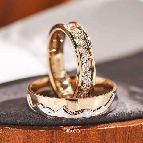 Our latest wedding band set features a bright cut pave ring in 18K yellow gold for her, adorned with alternating marquise and round diamonds. For him, a duo-tone ring with a White gold mountain motif backed by a sky of yellow gold. These custom-made rings make a unique and powerful statement of love and commitment. Masc Lesbian Wedding Ring, Wedding Bands His And Hers Unique, Wedding Rings Sets His And Hers Unique, Wedding Ring Ideas Unique, Unique Diamond Wedding Bands, خواتم خطوبة, Wedding Rings Sets His And Hers, Gold Mountain, Couple Ring Design