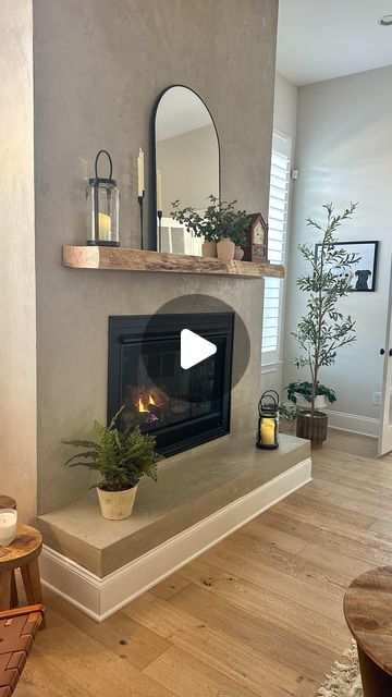 Lory Colella | Home design/decor + DIY on Instagram: "One of my most frequently asked questions…  What is on your fireplace?  It actually a faux concrete! A really affordable option to this very cool modern/industrial look!  The mantle is also always asked about and it’s a solid maple piece from a local woodworker, raw edge. The best part is our antique clock gifted by my parents this Christmas 🫶  Follow me here, @thecolellahome, for more design tips and inspiration!  #Fireplace #FireplaceInspiration #FauxConcreteFireplace #NeutralHome #ModernOrganic #VintageDecor #InteriorDesign #InteriorStyle #ａｅｓｔｈｅｔｉｃ #CozyHome #HouseToHome #HomeSweetHome" Concrete Electric Fireplace, Concrete Fireplace With Wood Mantle, Faux Concrete Fireplace, Wood Mantle Fireplace, Wood Mantle, Concrete Fireplace, Fireplace Remodel, The Mantle, Antique Clock