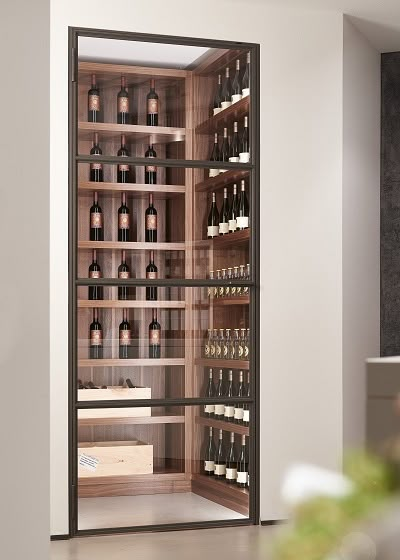 White Oak Wine Cellar, Modern Wine Closet, Kitchen Wine Glass Storage, Glass Wine Wall, Steel Framed Doors, Wine Cellar Closet, Wine Cellar Modern, Under Stairs Wine Cellar, Modern Wine Storage