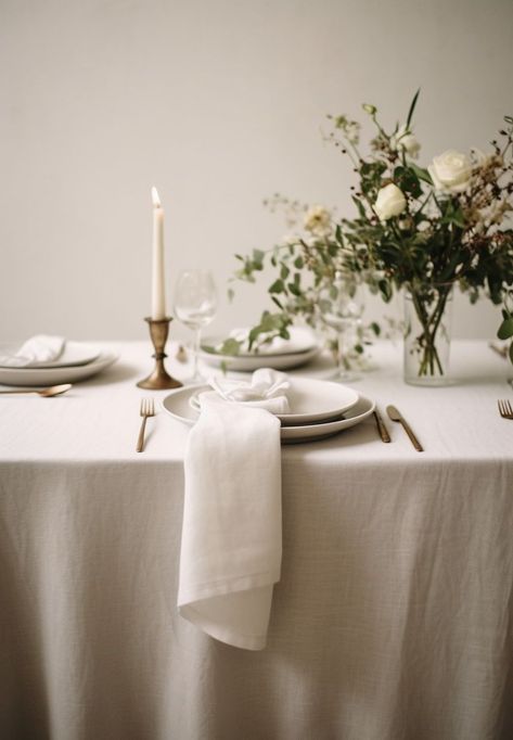 Create the perfect ambiance for an elegant wedding with a beautifully set table featuring a linen tablecloth. The soft and luxurious texture of the linen adds a touch of sophistication to the overall decor. Pair it with delicate china, sparkling glassware, and polished silverware to create a stunning tablescape. The neutral color of the linen allows for endless possibilities when it comes to floral arrangements and centerpiece designs. Tablecloth Inspiration, Gray Tablecloth, Linen Table Settings, Farmhouse Tablecloth, Floral Table Setting, Green Tablescape, Natural Farmhouse, Designer Pillow Covers, Glendale California