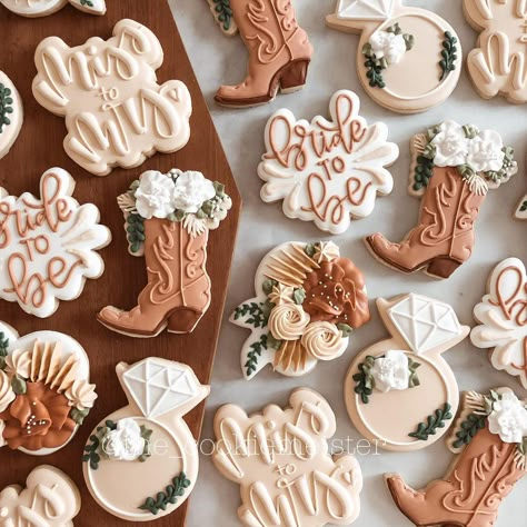 Kristy on Instagram: “Boots and Bubbly! This might be one of my fave sets YET!! Loving this boho cowgirl bridal shower theme!! How about those boots?? I die 😍 .…” Cowboy Boot Bridal Shower Cookies, Engagement Party Ideas Western, Rustic Western Bridal Shower Ideas, Cowgirl Bachelorette Party Cookies, Cowgirl Theme Bridal Shower Ideas, Boho Western Cookies Decorated, Country Wedding Cookies Decorated, Rustic Bridal Shower Cookies Decorated, Rustic Bridal Shower Cupcakes