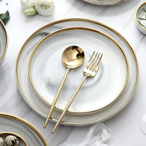 Have a good time with your families and friends and enjoy good food with these distinct 18-piece dinnerware sets. Gold rim design and delicate marble pattern are a great combination for adding exquisite modern appeal to your tablescape. It includes dinner plates, bowls, spoons, and so on. Crafted from premium ceramic, it allows a timeless look and beauty. Modern Dining Plate Set, Dinner Sets Dinnerware Tableware, Dining Table Plate Set Up, Elegant Plates Sets, White And Gold Dinnerware, Dinner Service Set, Modern Kitchen Plates, Kitchen Bowls Set, Spoon Design Ideas