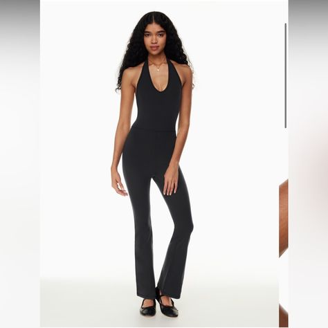 Nwt. Zero Flaws, Never Worn, Brand New! Wilfred Free Look Flare Jumpsuit Black Color #105292 Super Cute Halter Jumpsuit With Sweat Wicking Material And Cute Back! Sold Out Online!! This Is A Flare-Leg Jumpsuit With A Halter Scoop Neckline. It’s Made With Body-Hugging Fabric That’s Sweat-Wicking And Cottony-Soft. Materials & Care Content: 82% Nylon, 18% Elastane Care: Machine Wash Imported Aritzia Jumpsuit Long Sleeve, Fitted Halter Neck Jumpsuit For Loungewear, Aritzia Flared Jumpsuit, Black Athleisure Jumpsuit With Built-in Bra, Black High Stretch Backless Jumpsuit/romper, Aritzia Pants, Flare Jumpsuit, Halter Jumpsuit, Black Halter