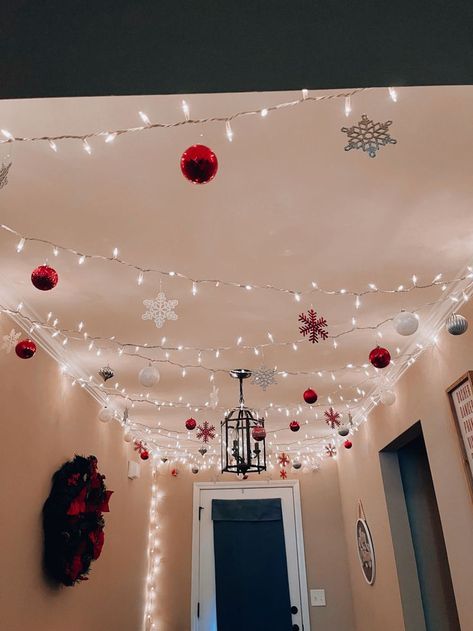 Christmas Ornament Hanging From Ceiling, Christmas Lights In The Bedroom Ceiling, Hallway Lights Christmas, Christmas Decor Ideas Renter Friendly, Christmas Light Decor Ideas Outdoor, Christmas Decor For Ceiling, Interior Christmas Light Ideas, Christmas Decor Ideas Cabinets, College Dorm Room Christmas Decorations