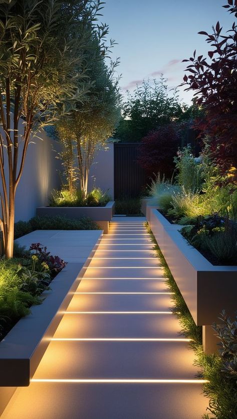 1Landscape Design6 Modern garden with illuminated pathway and lush greenery at dusk. | Sky Rye Design Small Modern Gardens, Outside Landscape Ideas, Simple Home Garden Ideas, Front Door Walkway Ideas, Perimeter Garden, Aesthetic Garden Ideas, Side Yard Ideas, Modern Landscape Design Front Yard, Contemporary House Designs