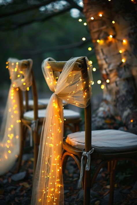 Transform your wedding into a fairytale with these stunning chair decorations. Tulle sashes and fairy lights add an ethereal touch to your reception. ✨🎀💡 Easy DIY setup for a night of wonder. #WeddingInspiration #FairyLights #DIYWedding #WeddingDecor #TulleDecorations #MagicalEvening #BridalStyle #WeddingChairDecor Let the romance sparkle! Lighting Decoration For Wedding, Twinkle Light Indoor Reception, Fairylight Wedding Decor, Twinkle Lights For Wedding, Lights In Trees For Wedding, Diy Wedding Lights, Different Chairs Wedding, Wedding Aesthetic Ideas Fall, Fairytale Reception Decor