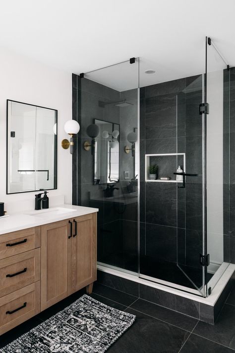 Modern Bathroom With Black Floor, Same Tile Floor And Shower Master Bath, Bathroom Design With Black Tiles, Black Shower Base Bathroom, Modern Bathroom Design Dark Floor, Black Shower Ensuite, Black Tile Restroom, Black Rectangle Tile Bathroom Floor, Walk In Shower With Black Fixtures