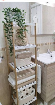 Sink With No Counter Space, Ways To Store Towels In Bathroom, Eucalyptus Bathroom Decor Ideas, Bathroom Bamboo Decor, Boho Bathroom Apartment, Gender Neutral Apartment Decor, Bathroom Towel Organization, Organization For Small Bathroom, Bathroom Nature Theme