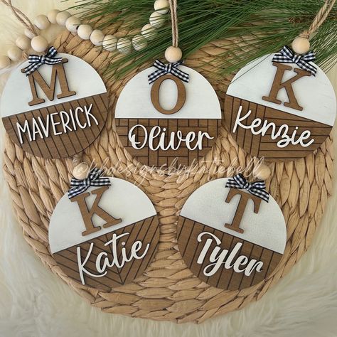 Super cute round wooden Christmas ornaments personalized with your name, and shiplap design of choice. These ornaments make the perfect Christmas gift for your entire family! -5 different shiplap engraving designs to choose from -5 different fonts to choose from Dimensions:  - 3.75" x 3.75" Wooden, laser cut & engraved, stained and painted. No returns or refunds on custom orders, please ensure your spelling is correct when ordering. Yearly Christmas Ornaments, Beginner Laser Engraving, Christmas Tree Family Ornaments, Round Wood Name Signs, Cut Wood Ornaments With Cricut, Easy Wooden Ornaments, Cricut Christmas Ornaments Wooden, Simple Wood Ornaments, Ornament Quotes Christmas