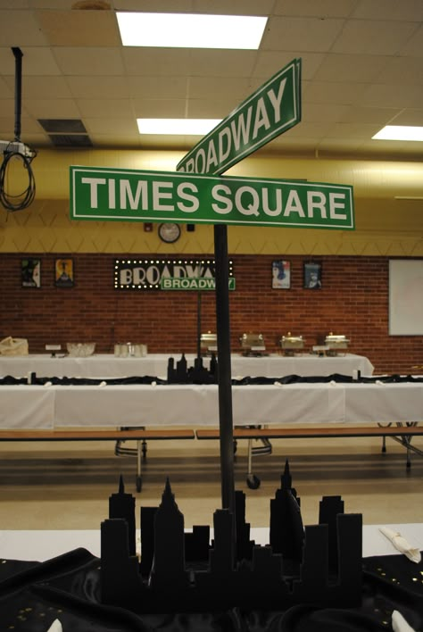 Broadway themed centerpieces made from foam board, printed playbills and inexpensive street signs bought online New York Themed Centerpieces, Broadway Party Decorations, Broadway Decorations, City Party Theme, Hoco Decor, Broadway Sign, New York Theme Party, Ny Party, New York Dance