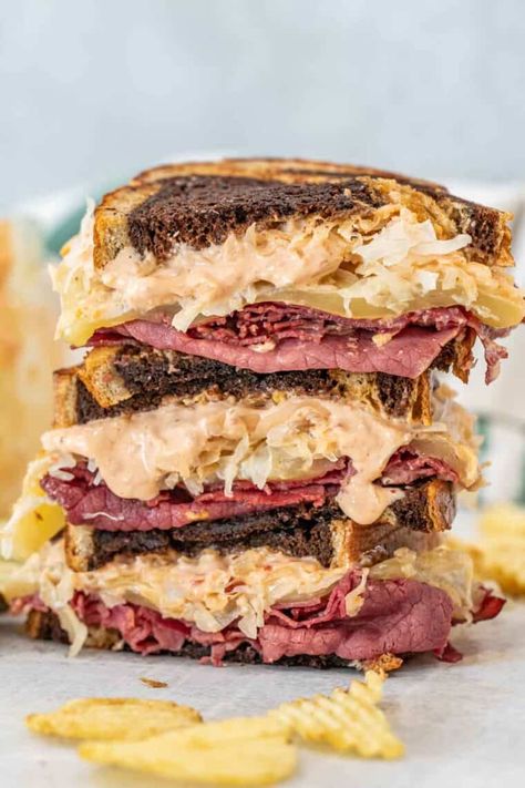 The BEST recipe for homemade Reuben sandwich made with slices of corned beef sauerkraut, Swiss cheese, and our homemade Russian dressing in-between slices of rye bread. Homemade Russian Dressing, Classic Reuben Sandwich, Reuben Sandwich Recipe, Reuben Sandwich Classic, Mac And Cheese Sauce, Homemade Corned Beef, Best Sandwich Recipes, Russian Dressing, Reuben Sandwich