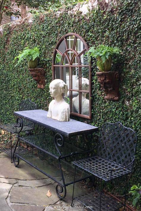 Secret garden decorations including an outdoor mirror, console table, statue and wall sconces Table Statue, Secret Garden Ideas, Charleston Gardens, Garden Escape, Tattoo Plant, Relaxing Backyard, Outdoor Console Table, Backyard Shade, Backyard Plan