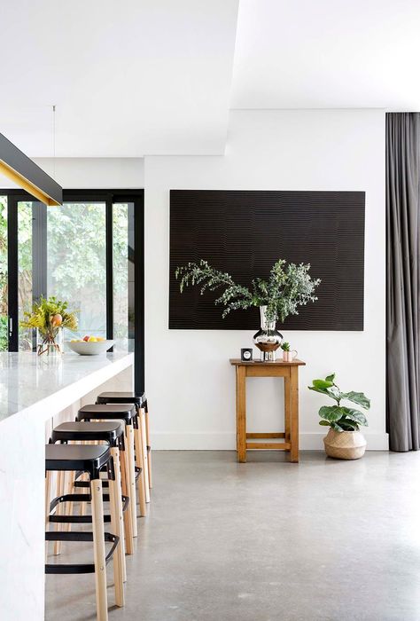 This family of five transformed their 1920s home with an Italian-style garden to emulate an industrial aesthetic. See how they did it here. Concrete Floors Living Room, Concrete Floors In House, Kitchen Flooring Trends, Plywood Floors, 1920s Home, Kid Furniture, Australian House, Flooring Laminate, Daybed Design