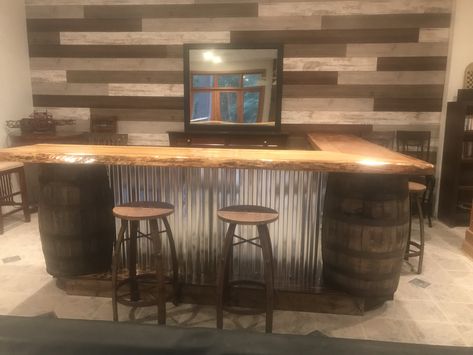 Bar Made From Whiskey Barrels, Whiskey Barrel Basement, Bar With Barrels, Bar With Whiskey Barrels, Diy Whiskey Barrel Bar, Old Saloon Bar Ideas, Rustic Bar Top Ideas, Corner Bar Shelves Ideas Liquor, Rustic Bar Ideas For Home Basement