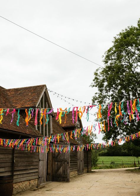 COLOURFUL FESTIVAL WEDDING :rainbow::cupid: Acid-bright barn wedding in the woods, Sussex. A festival inspired with colourful alter bunting, colour pop decor and glamping || #colourfulwedding #festivalwedding #festivalweddings #festivalweddingideas #outdoorwedding #barnwedding #barnwedding #barnweddings #sussexwedding #sussexweddingvenue #creativewedding #humanistceremony #woodlandwedding #woodlandweddings #bunting #glamping Colourful Backyard Wedding, Wedding Alter Outdoors, Wedding Festival Invitation, Festival Wedding Decor, Festival Bar Design, Festival Theme Wedding, Funky Wedding Ideas, Colourful Wedding Decor, Wedfest Ideas