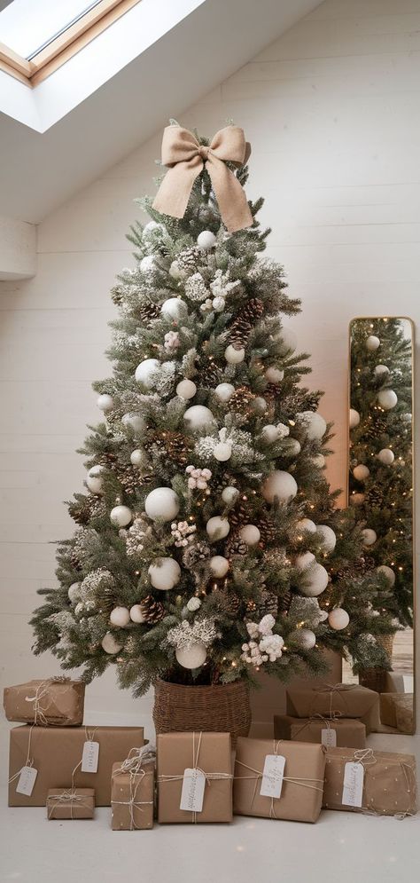 Cozy Woodland Christmas Tree Themes for a Rustic Look Christmas Tree Ideas Modern Farmhouse, Christmas Tree With Flocked Ornaments, Frosty Christmas Tree Decorating Ideas, Modern Tree Topper Ideas, Elegant Neutral Christmas Tree, Fluffy Christmas Trees, Christmas Tree Elegant Beautiful, Beige And White Christmas Tree, Modern Coastal Christmas Tree