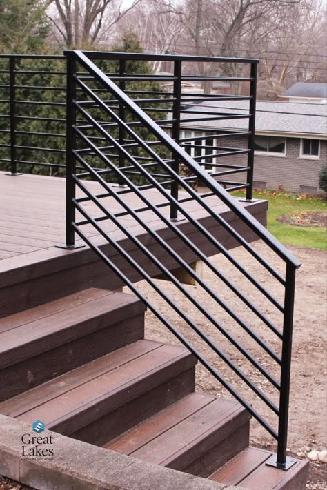 With horizontal metal railing, a traditional brick home gets a modern makeover with new deck and steel railing. Secure and beautiful design for any project. Metal Outdoor Railing Ideas, Ramp Railing Design Outdoor, Wood Deck Metal Railing, Patio Railings Metal, Steel Railings Outdoor, Black Wire Porch Railing, Outdoor Horizontal Railing, Horizontal Metal Deck Railing, Metal Stair Railing Outdoor